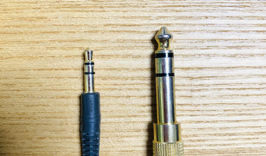 1/8" phone plug and 1/4" phone plug